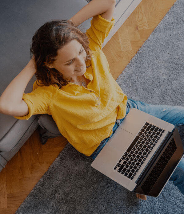 Woman using her laptop to surf the internet.